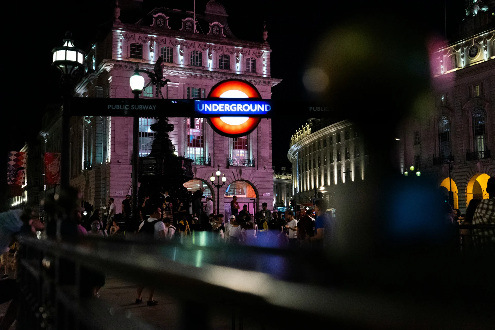 London Underground roundel sign at Piccadilly Circus at night