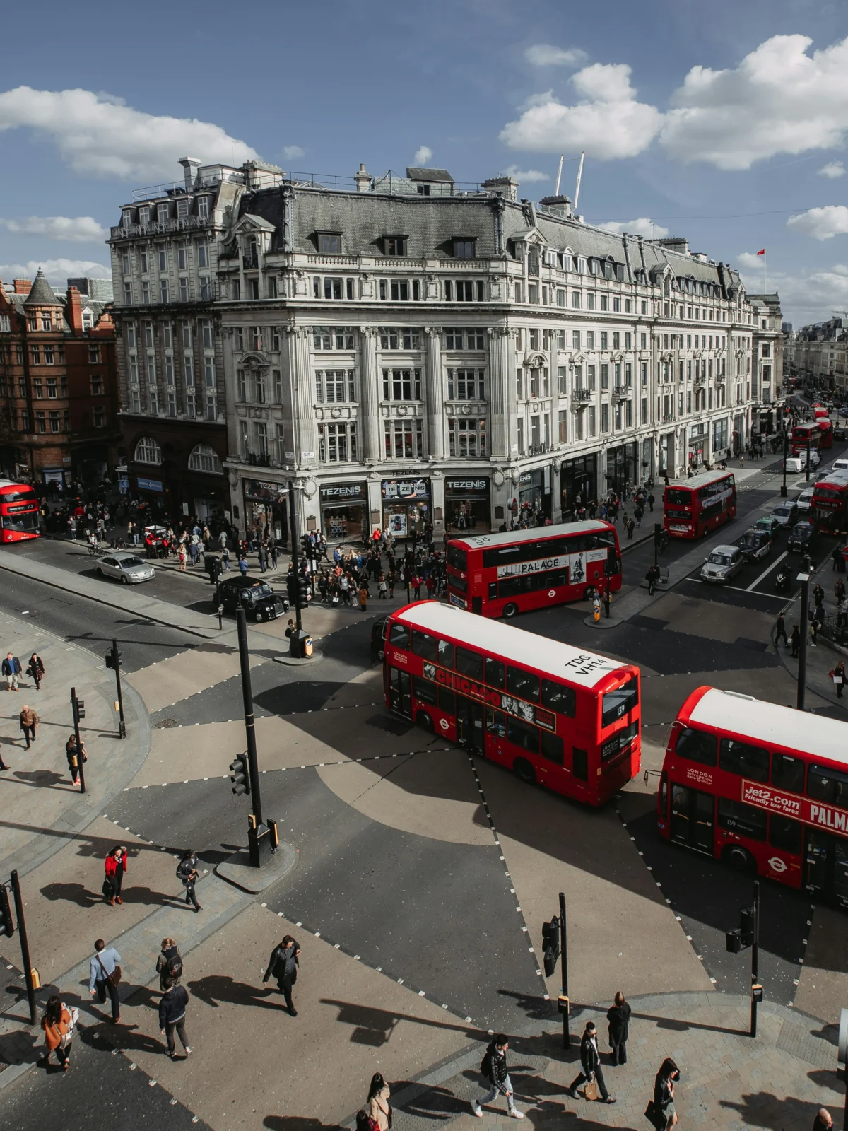 Red double-decker buses on Oxford Street seen from above