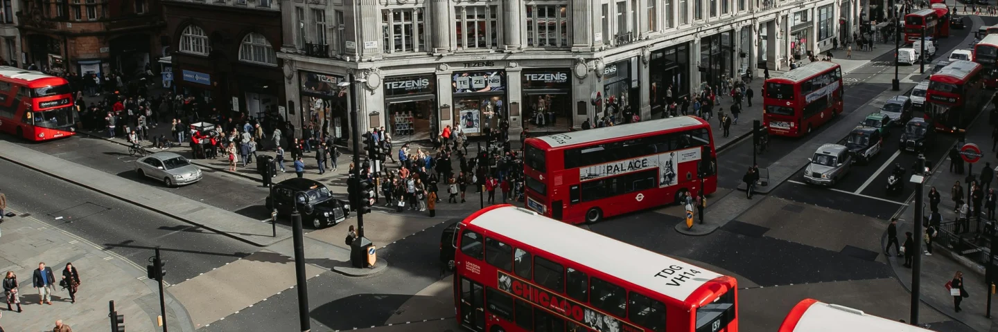 Red double-decker buses on Oxford Street seen from above