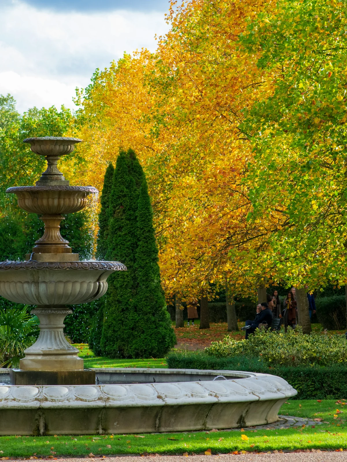 Stone fountain and autumn trees in Regent’s Park
