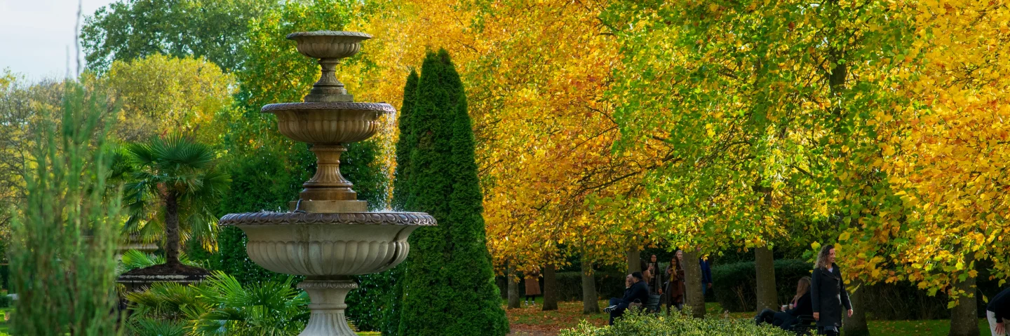 Stone fountain and autumn trees in Regent’s Park